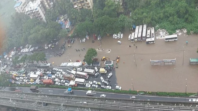 Heavy rain disrupts Mumbai flights and trains as Mithi River overflows