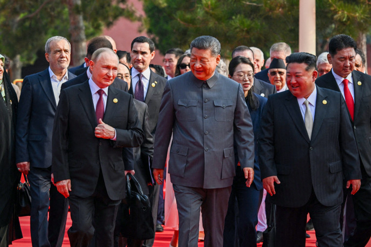 Russian airstrikes hit Ukraine while Putin joins parade in China
